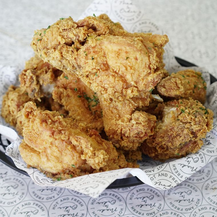 Whole chicken, specially fried, brushed in sauce